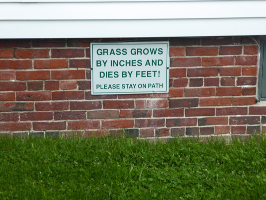 Grass grows by inches and dies by feet