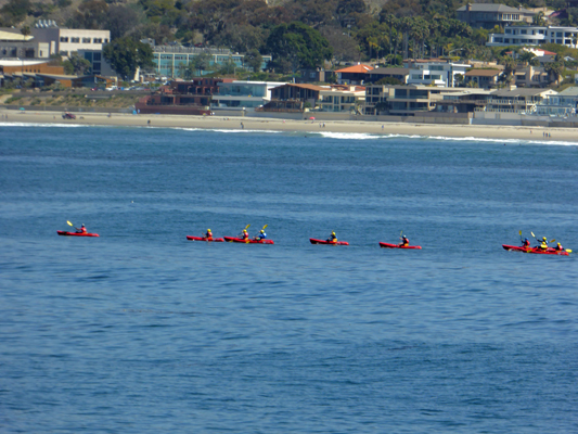 Red kayaks yellow paddles