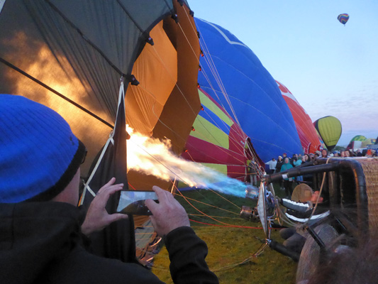 Hot air into a balloon