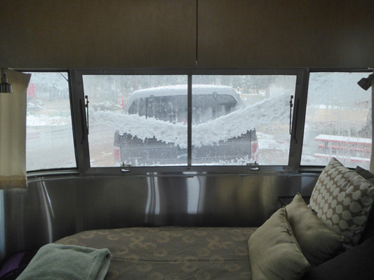 Snow slumping on Airstream window