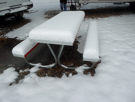 Picnic table in deep snow