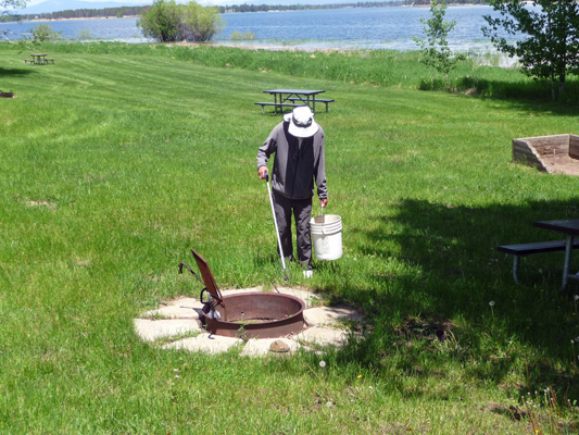 Walter Cooke cleaning firepit Buttercup Campground Lake Cascade SP