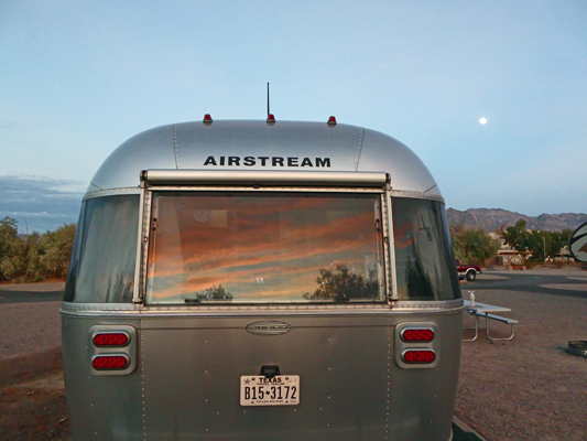 Sunset on Genevieve Airstream plus full moon