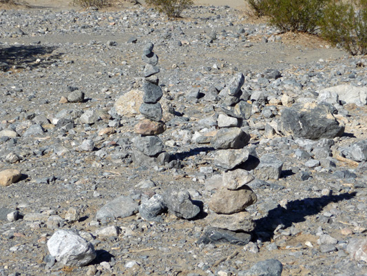 Rock cairns at Mesquite Sand Dunes Death Valley
