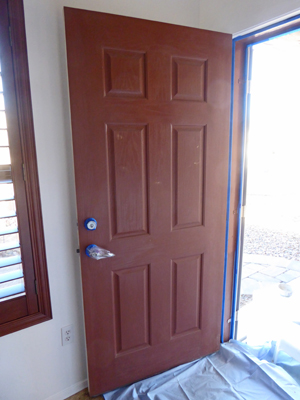 Front door with blue tape