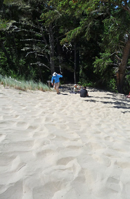 Walter Cooke walking up a sand dune