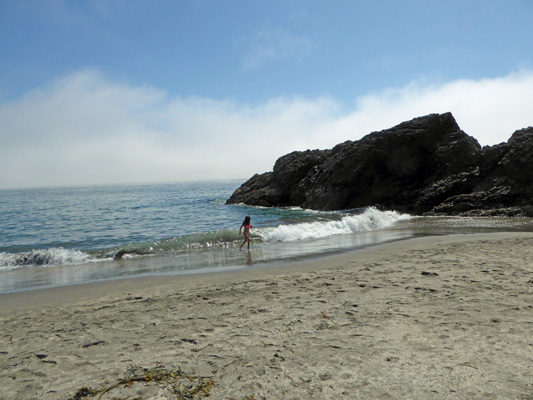 Harris Beach girl in surf