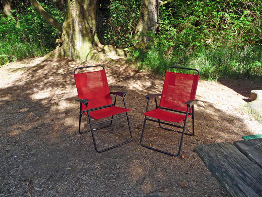 Red chairs in campsite