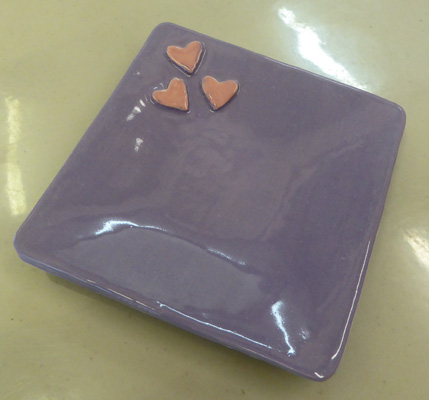 Hearts on a lavender jewelry dish.