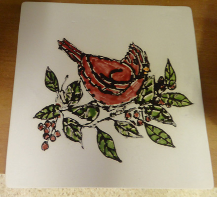 Trivet with cardinal in berry bush