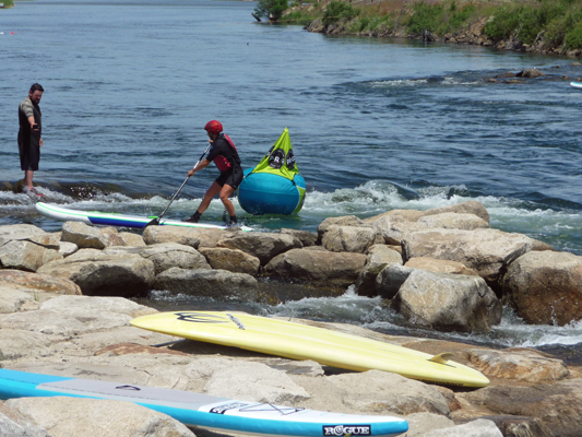 Stand up boarder going around buoy Kellys whitewater park ID