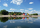 Umbrellas reflected in Lake Cascade