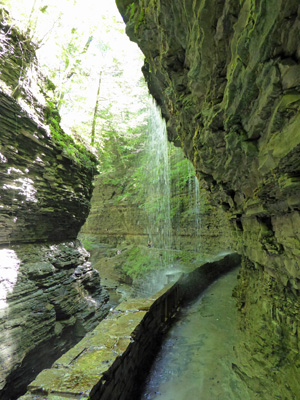 Walking under Rainbow Falls Watkins Glen