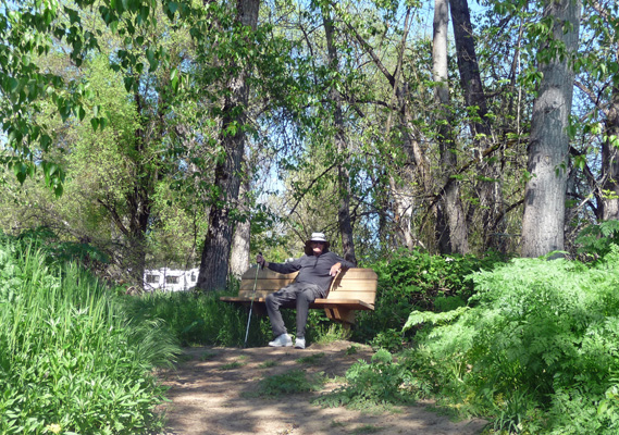 Walter Cooke on bench on Valley of Rogue trail