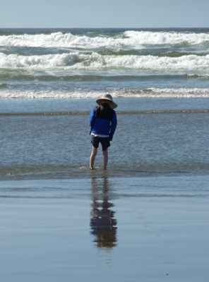 Kid wading in surf Fort Stevens SP