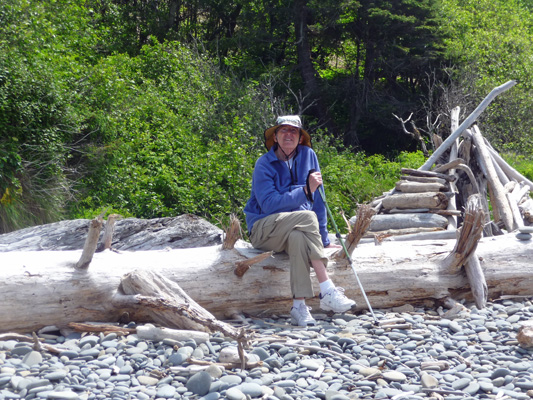 Walter Cooke sitting on a log Ruby Beach