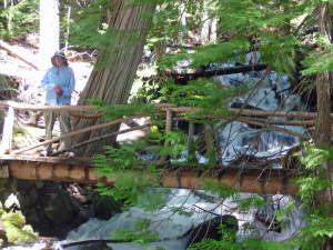 Walter Cooke standing on a bridge over Silver Creek on Silver Falls Trail WA
